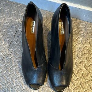 4” heals. They are beautiful and sexy but too tall for me these days.